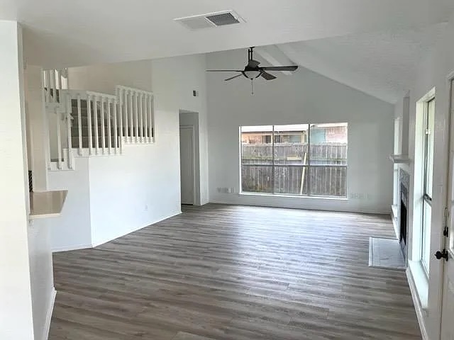 4410 Sojourner Street Austin, TX 78724 - Photo 8 of 15 a view of an empty room with wooden floor and a window