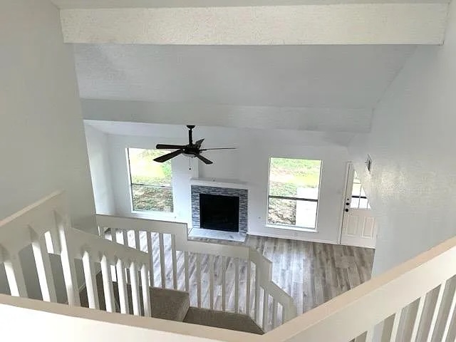 4410 Sojourner Street Austin, TX 78724 - Photo 10 of 15 a view of an empty room with wooden floor fireplace and a window