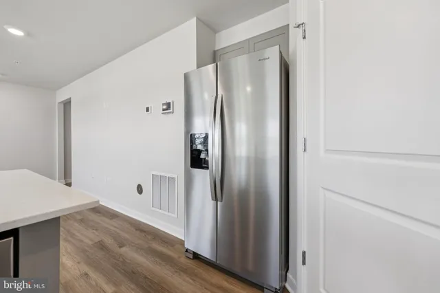 a bathroom with a shower and a glass door