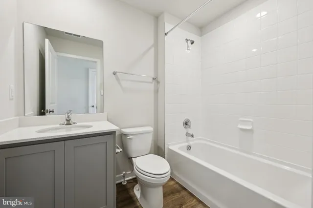 a room with linen closet and wooden floor