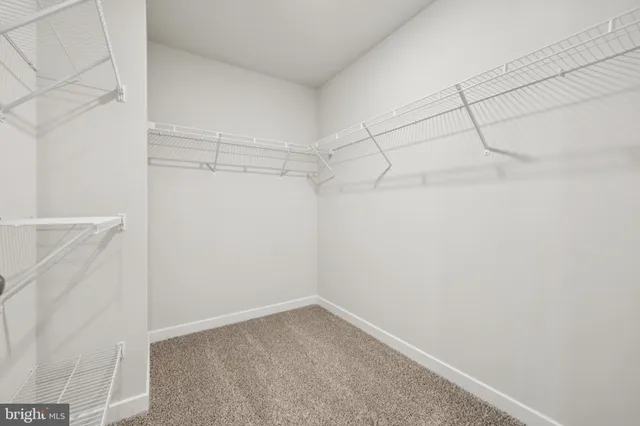 a front view of house with yard and garage