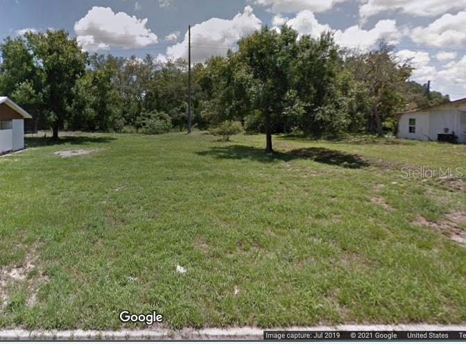 Google street view of vacant lot between two existing homes.