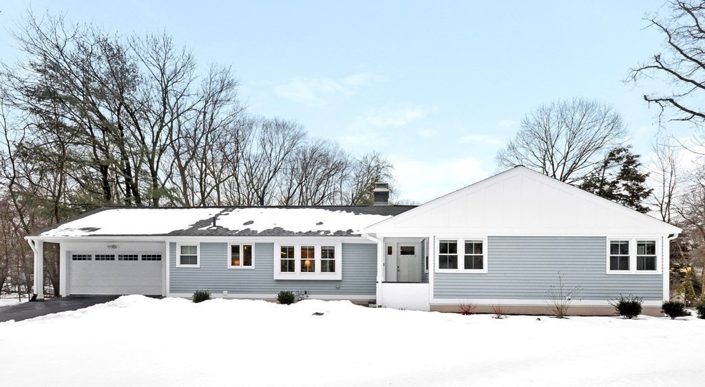 a view of a house with a yard covered with snow in the yard