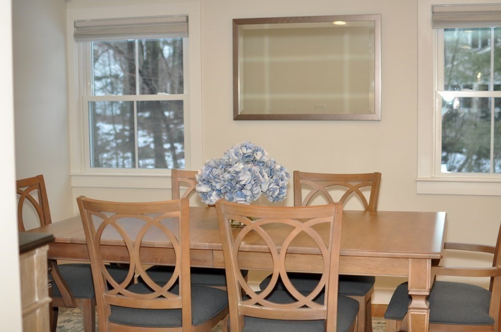 34 Fairbanks Road Lexington, MA 02421 - Photo 13 of 41 a view of a dining room with furniture and windows
