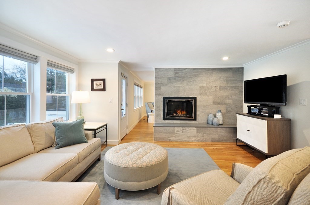 34 Fairbanks Road Lexington, MA 02421 - Photo 16 of 41 a living room with furniture and a flat screen tv