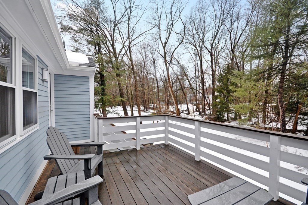 34 Fairbanks Road Lexington, MA 02421 - Photo 18 of 41 a view of a patio with wooden fence and large trees