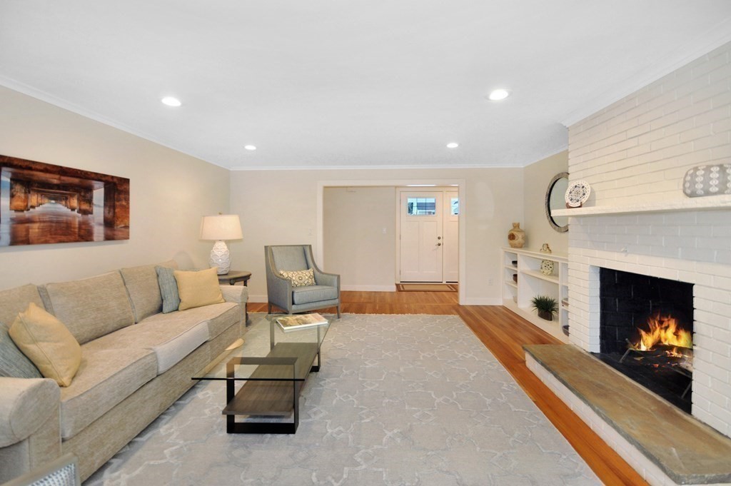 34 Fairbanks Road Lexington, MA 02421 - Photo 20 of 41 a living room with furniture and a fireplace