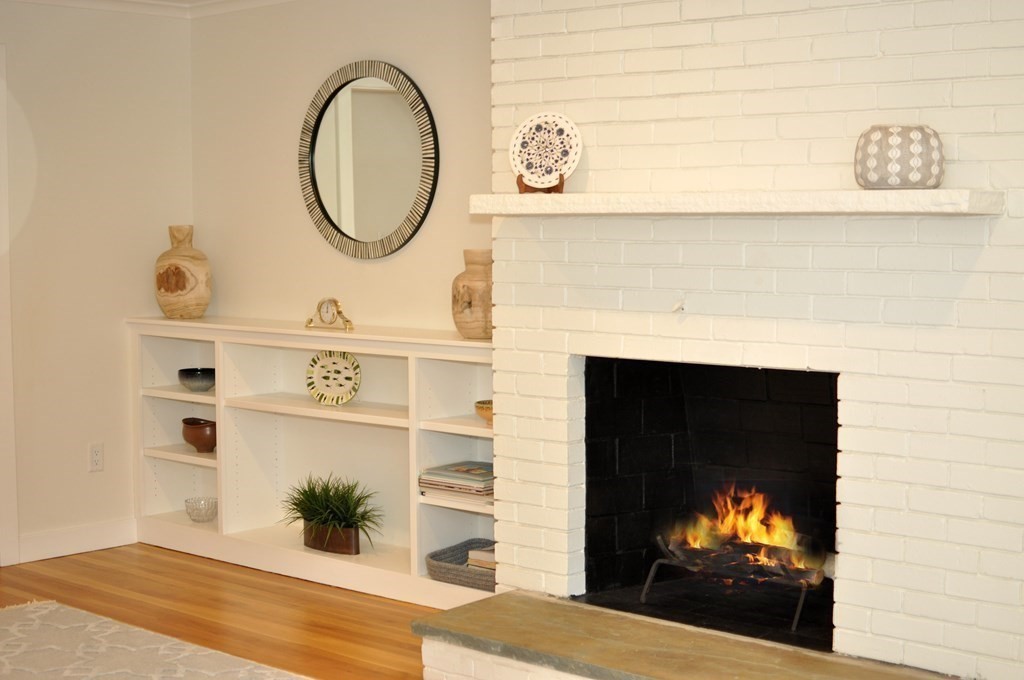 34 Fairbanks Road Lexington, MA 02421 - Photo 21 of 41 a view of a living room with a fireplace and wooden floor