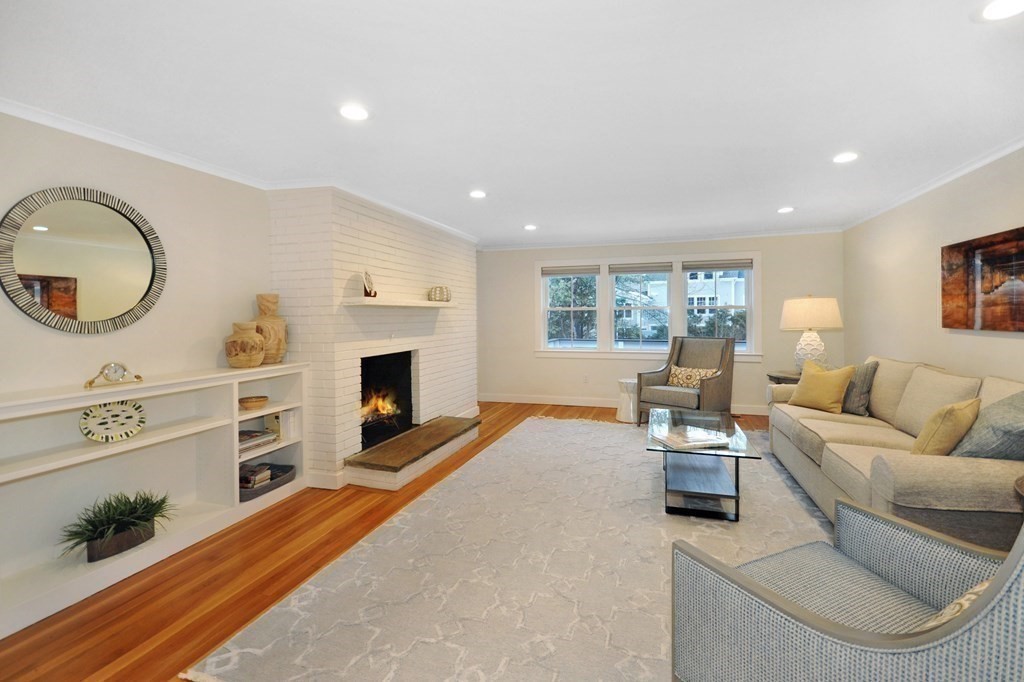 34 Fairbanks Road Lexington, MA 02421 - Photo 23 of 41 a living room with furniture and a fireplace