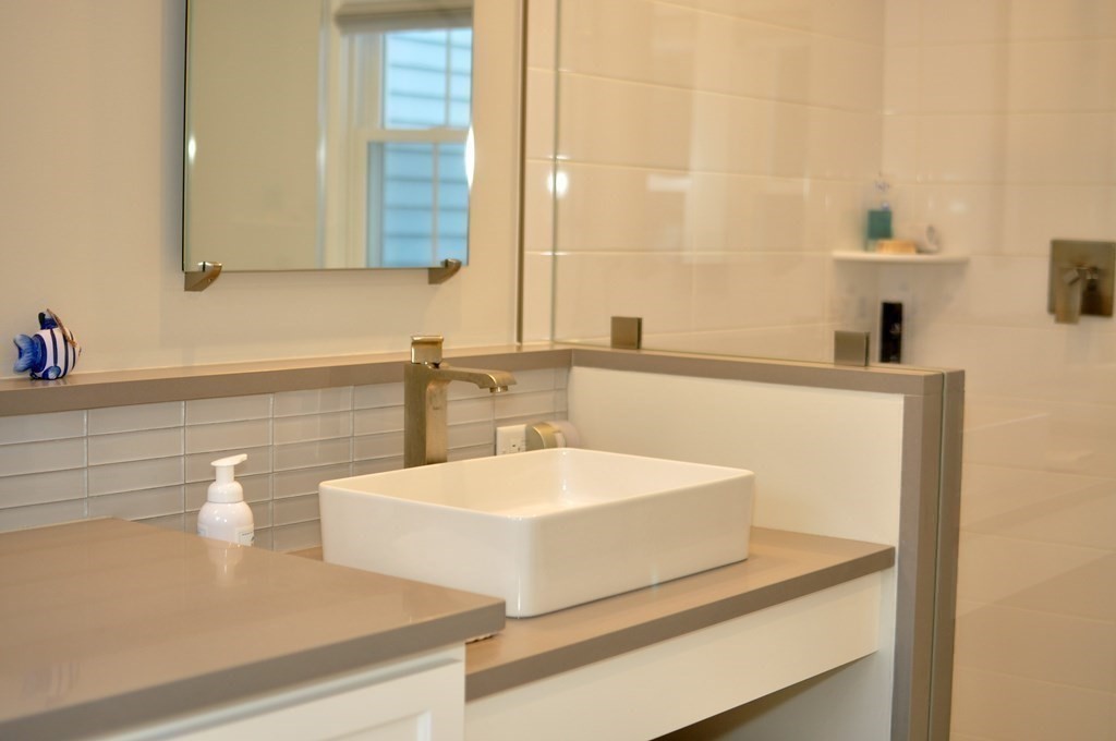 34 Fairbanks Road Lexington, MA 02421 - Photo 30 of 41 a bathroom with a sink and a mirror