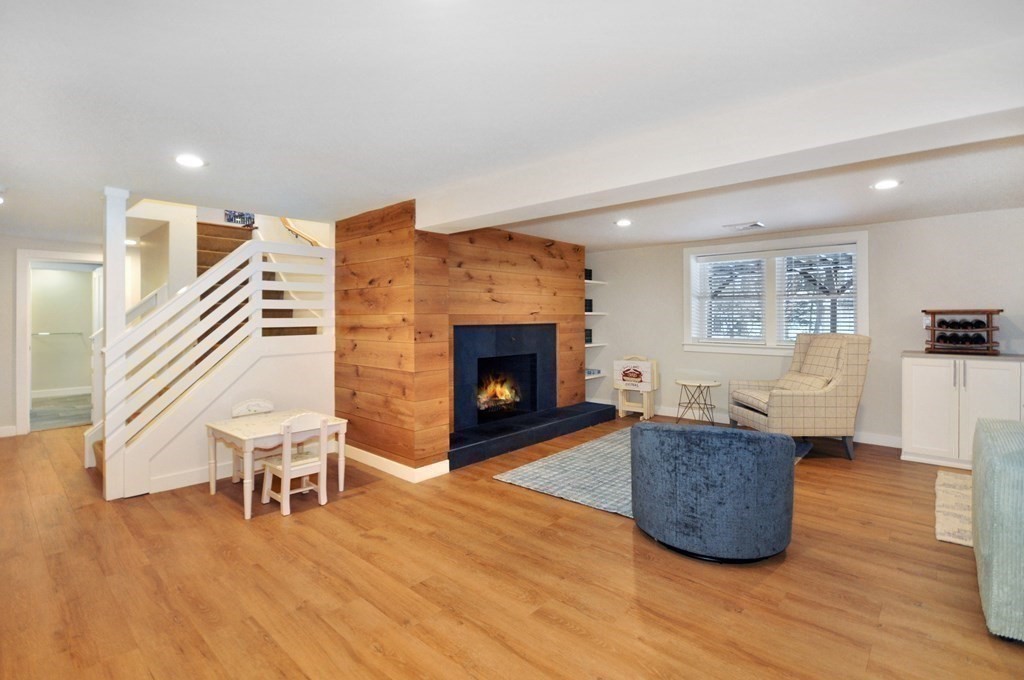 34 Fairbanks Road Lexington, MA 02421 - Photo 33 of 41 a living room with furniture and a fireplace