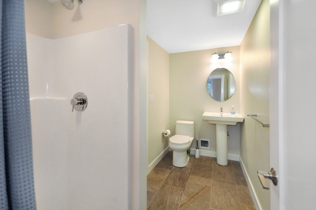 34 Fairbanks Road Lexington, MA 02421 - Photo 35 of 41 a bathroom with a toilet a sink and mirror