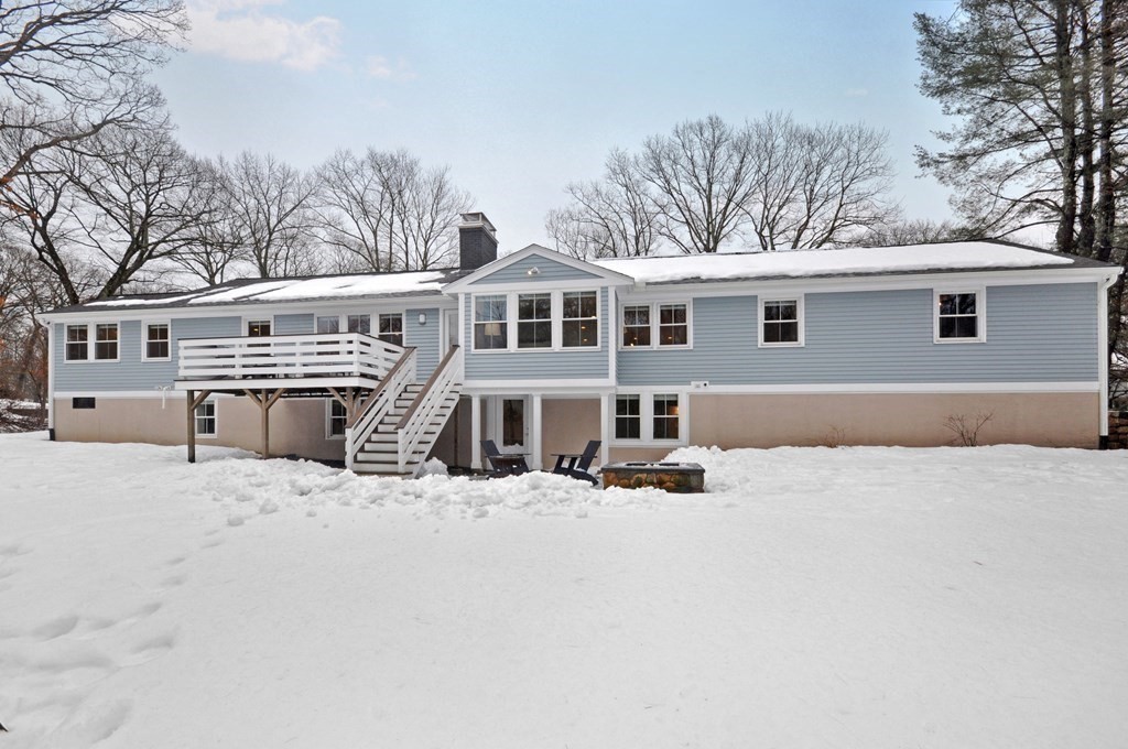 34 Fairbanks Road Lexington, MA 02421 - Photo 40 of 41 a front view of a house with yard covered in snow