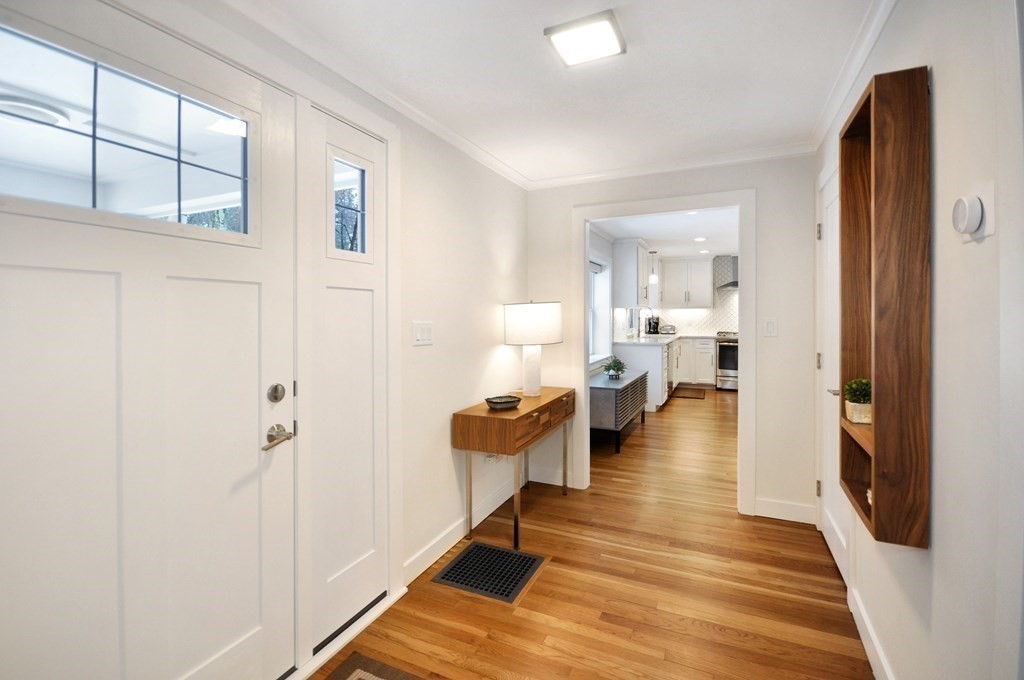 34 Fairbanks Road Lexington, MA 02421 - Photo 4 of 41 a view of a living room with furniture and wooden floor