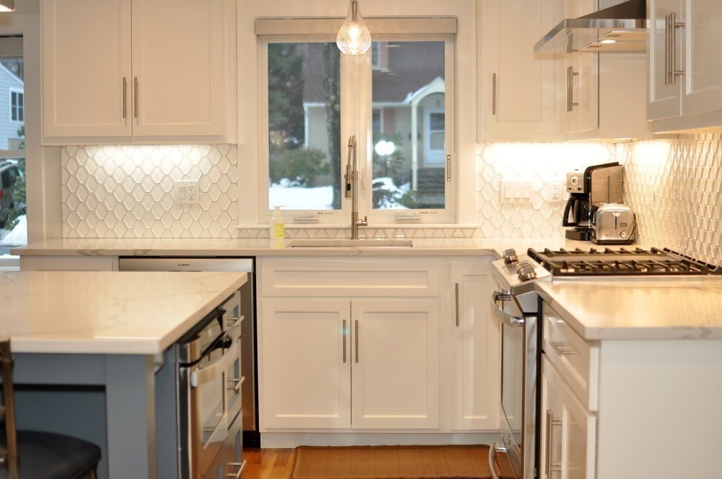 34 Fairbanks Road Lexington, MA 02421 - Photo 9 of 41 a kitchen with a sink stove and cabinets