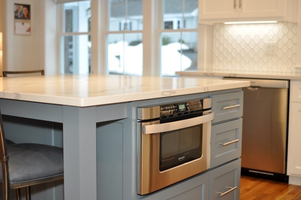 34 Fairbanks Road Lexington, MA 02421 - Photo 10 of 41 a kitchen with stainless steel appliances granite countertop a stove and a microwave