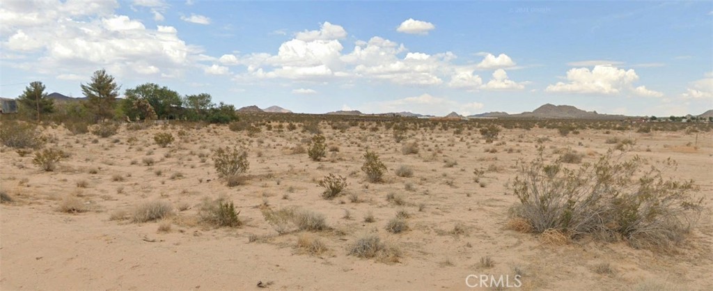 0 Vic Porter Road Lucerne Valley, CA 92356 - Photo 4 of 7 a view of a dry yard with mountains in the background