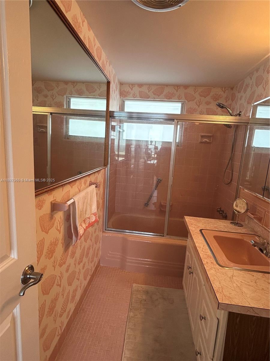 2840 North Ocean Boulevard, Unit 1008 Fort Lauderdale, FL 33308 - Photo 13 of 25 a bathroom with a sink a toilet and shower