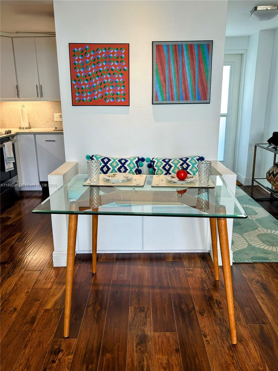 2840 North Ocean Boulevard, Unit 1008 Fort Lauderdale, FL 33308 - Photo 5 of 25 a view of a dining room with furniture and wooden floor