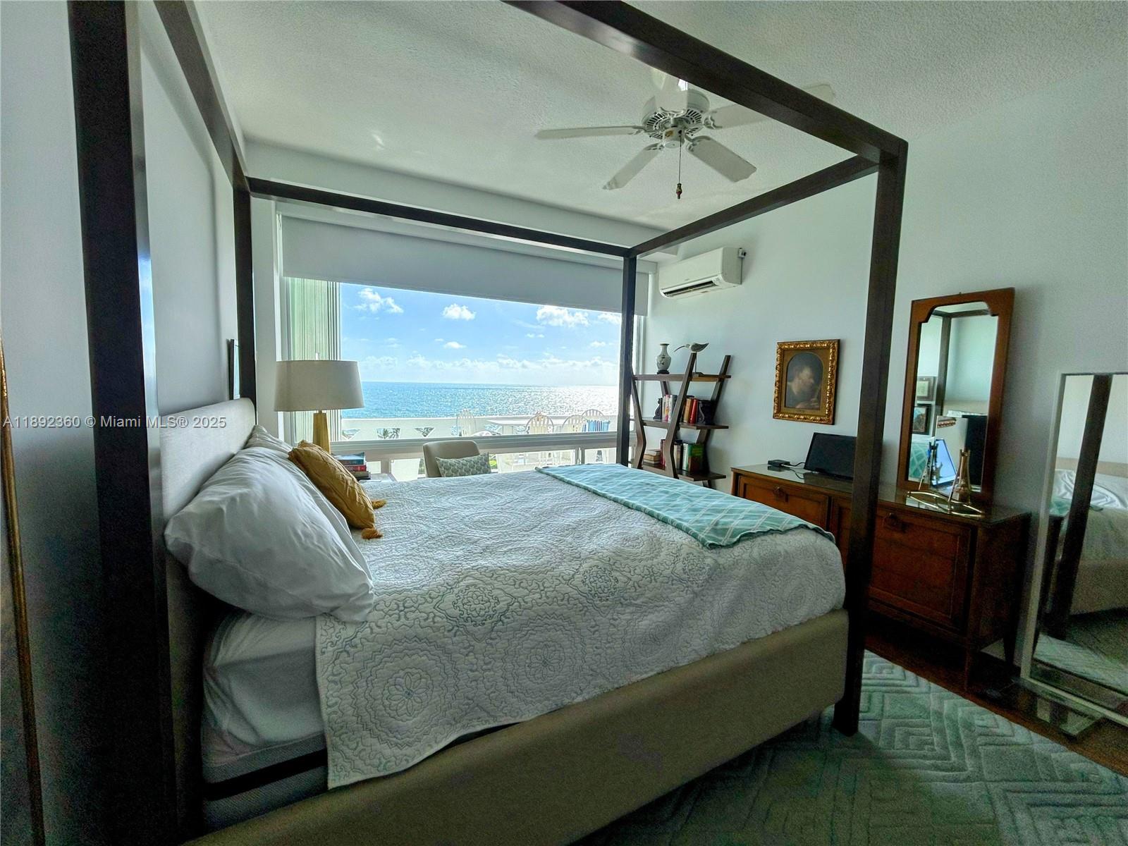 2840 North Ocean Boulevard, Unit 1008 Fort Lauderdale, FL 33308 - Photo 9 of 25 a bedroom with a bed window and walk in closet