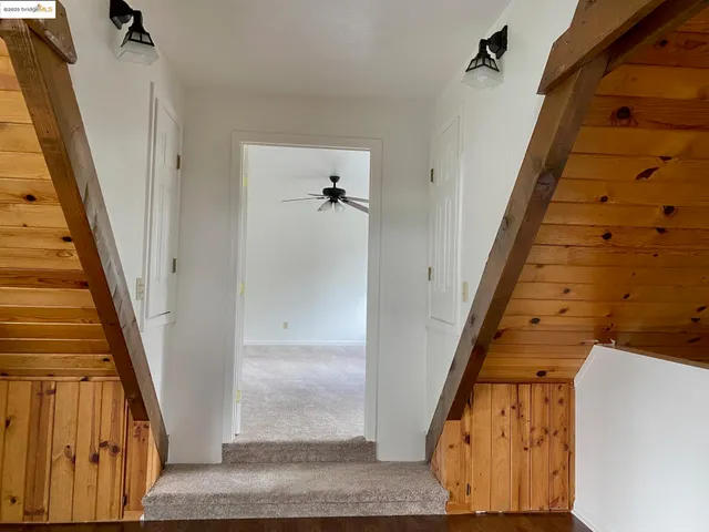 a view of staircase with wooden floor and staircase
