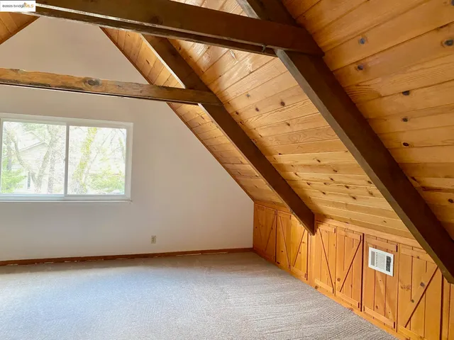 a view of a hallway with stairs