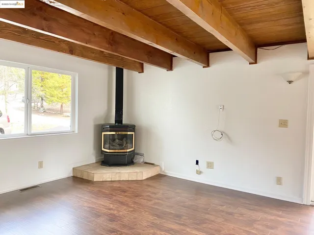 a view of a garage with wooden floor