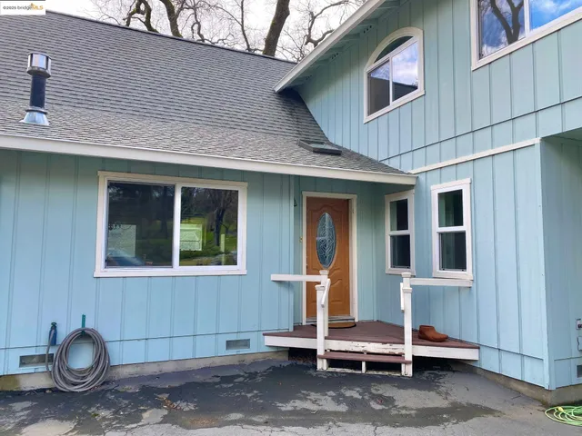 a view of a patio with table and chairs and potted plants
