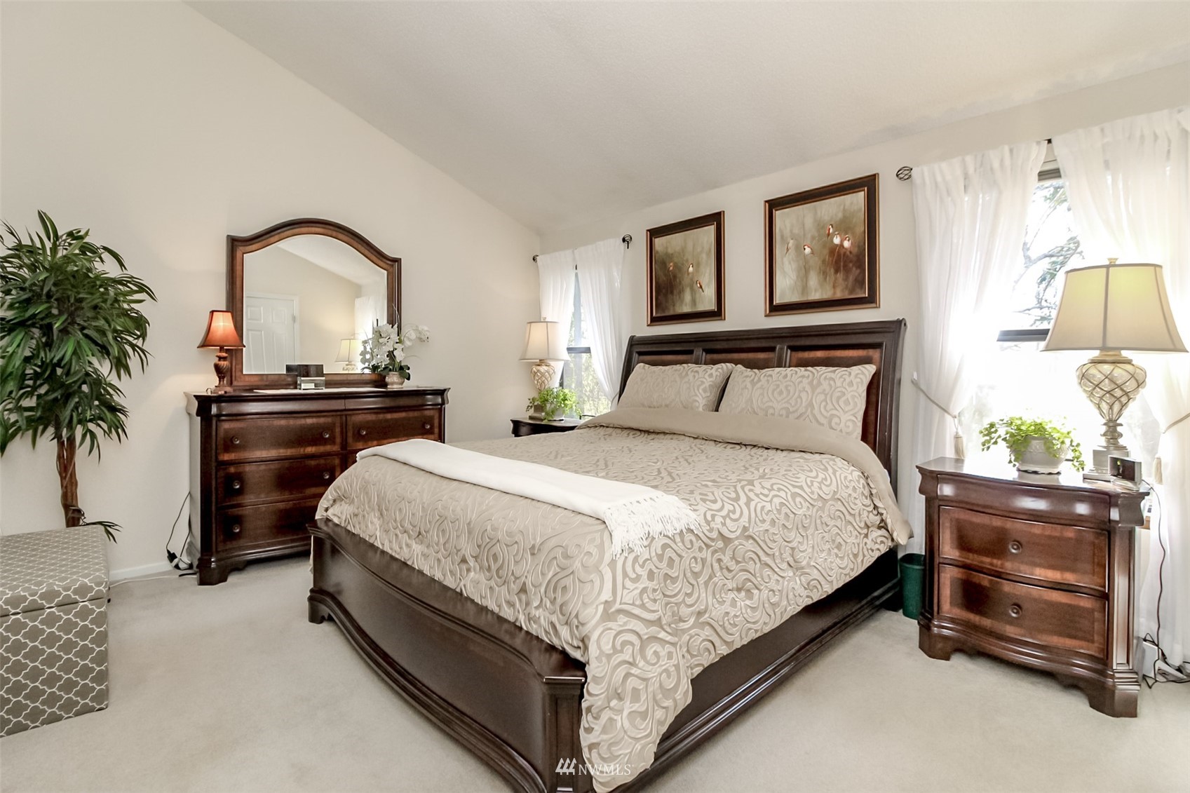 15007 Southeast 145th Place Renton, WA 98059 - Photo 12 of 34 a bedroom with a bed and a potted plant on dresser