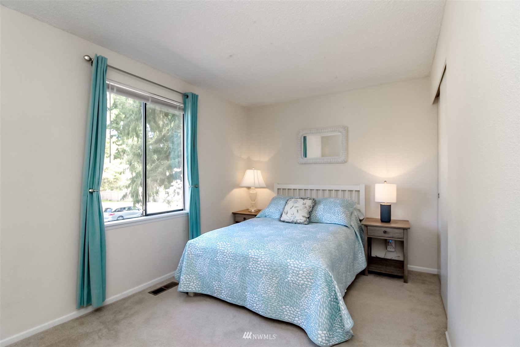 15007 Southeast 145th Place Renton, WA 98059 - Photo 16 of 34 a bedroom with a bed and a window
