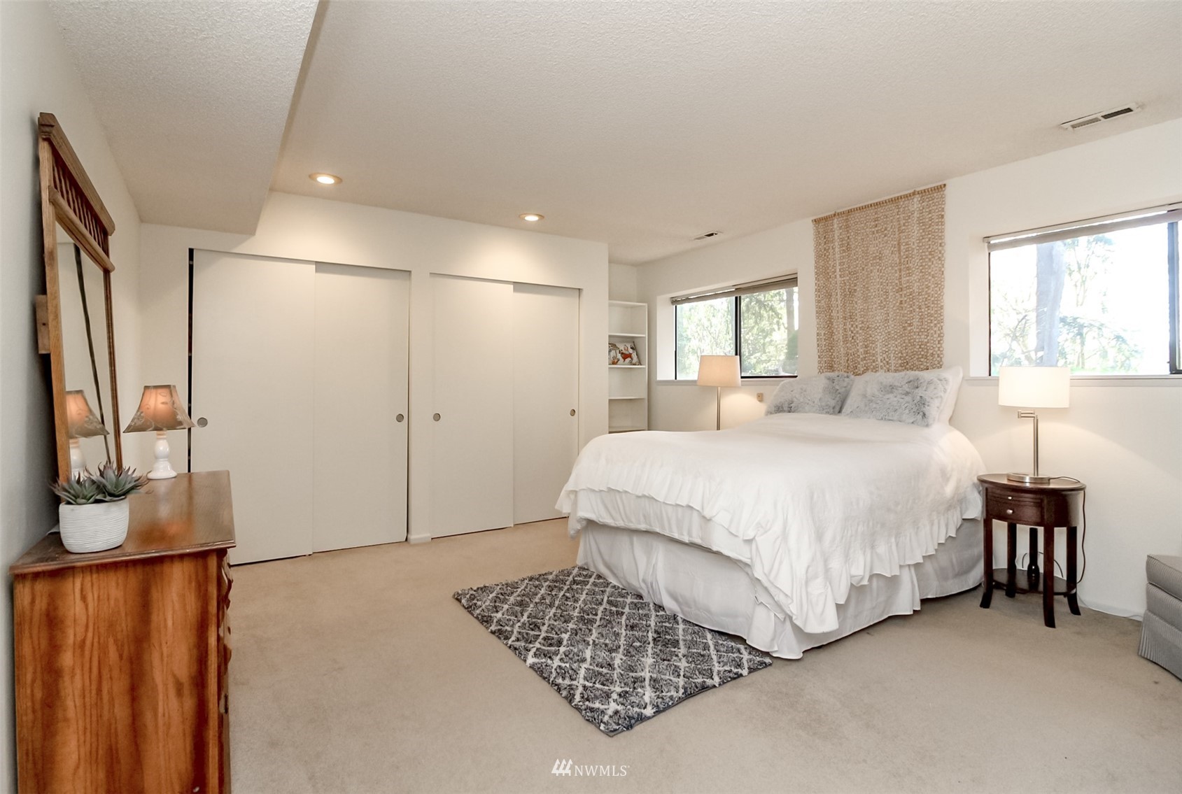 15007 Southeast 145th Place Renton, WA 98059 - Photo 20 of 34 a spacious bedroom with a bed and a window