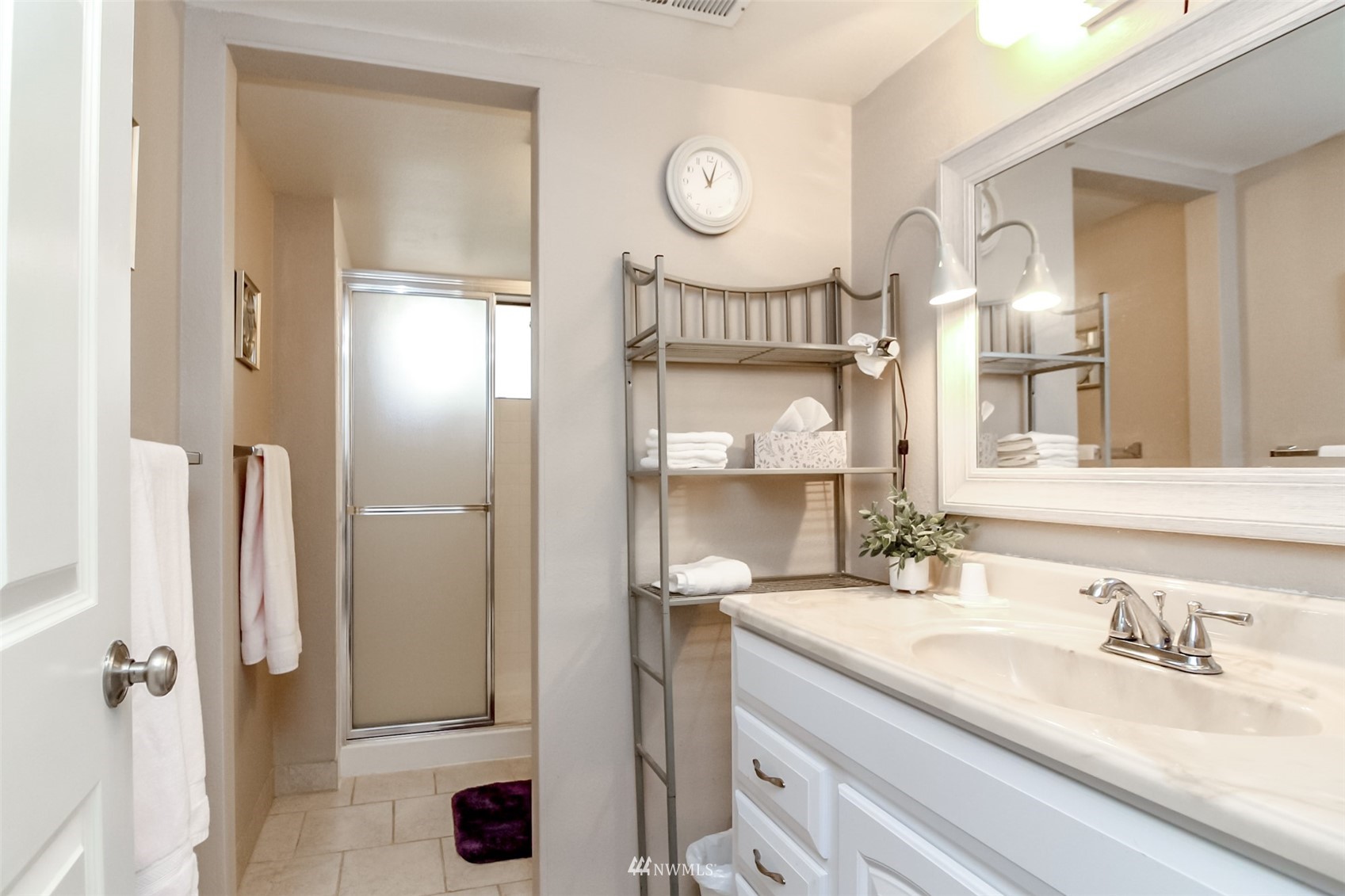15007 Southeast 145th Place Renton, WA 98059 - Photo 21 of 34 a bathroom with double vanity sink and a mirror