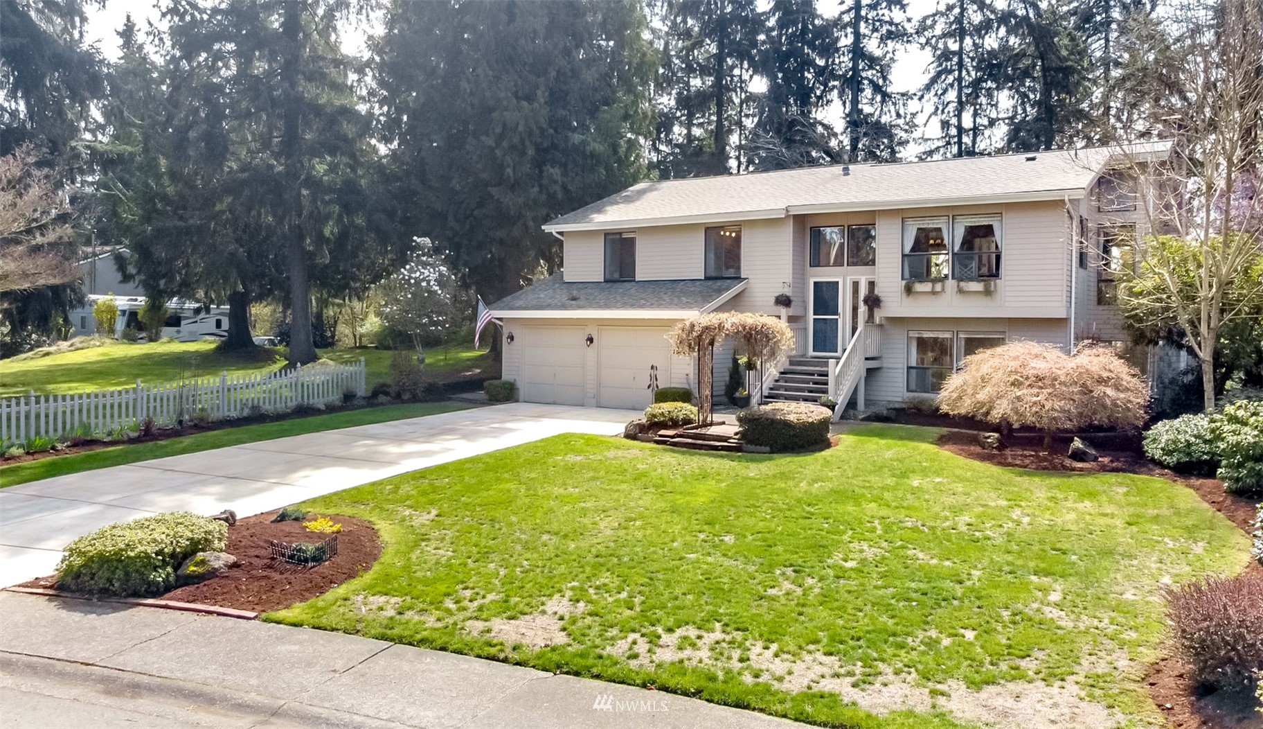 15007 Southeast 145th Place Renton, WA 98059 - Photo 33 of 34 a view of a house with backyard sitting area and garden