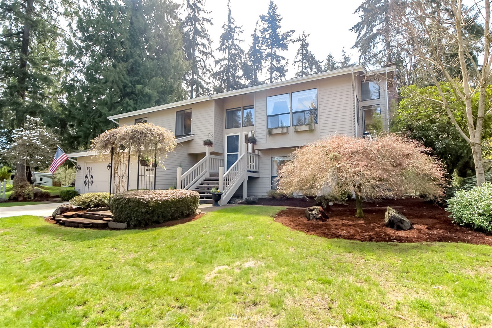 15007 Southeast 145th Place Renton, WA 98059 - Photo 34 of 34 a view of a house with backyard and garden