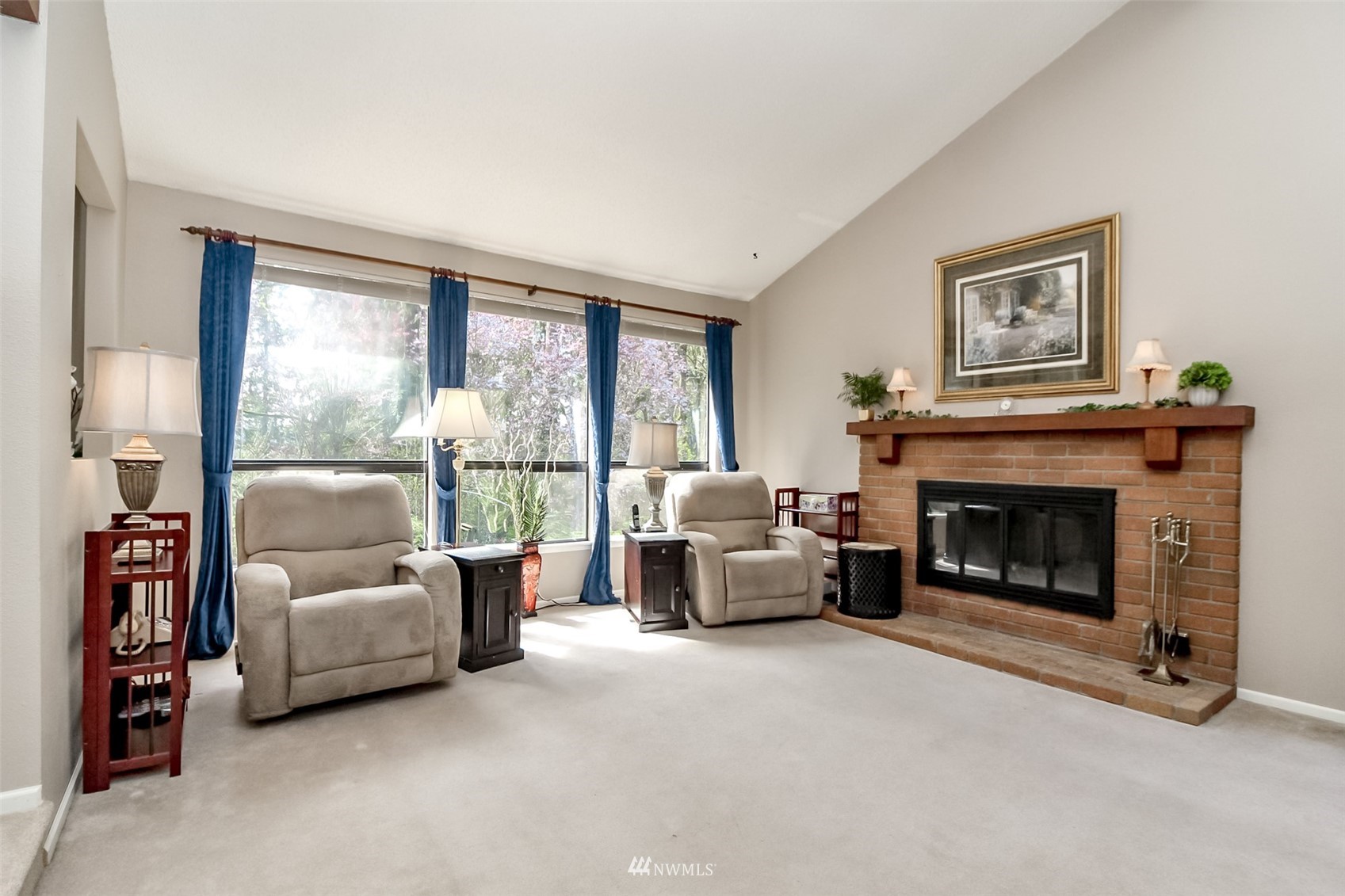 15007 Southeast 145th Place Renton, WA 98059 - Photo 4 of 34 a living room with furniture and a fireplace