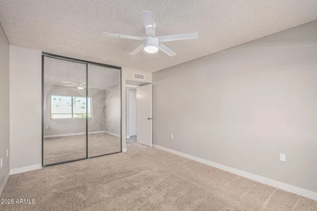 a bathroom with a bathtub shower sink vanity and mirror