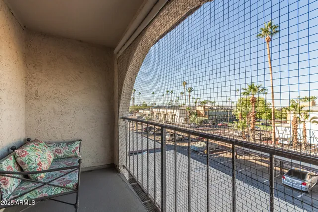a view of balcony with wooden floor