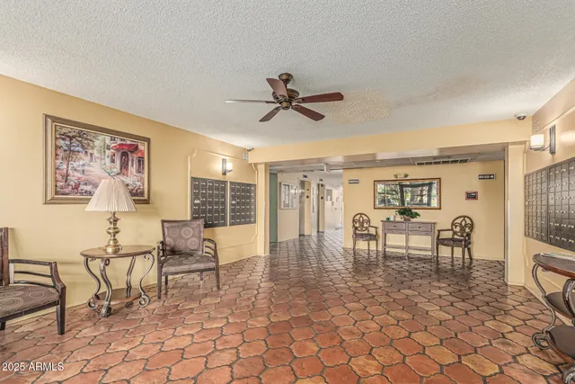 a room with a table chairs and a sink