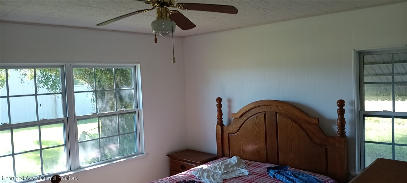 715 Stenstrom Road Wauchula, FL 33873 - Photo 8 of 11 a bedroom with a bed and a window