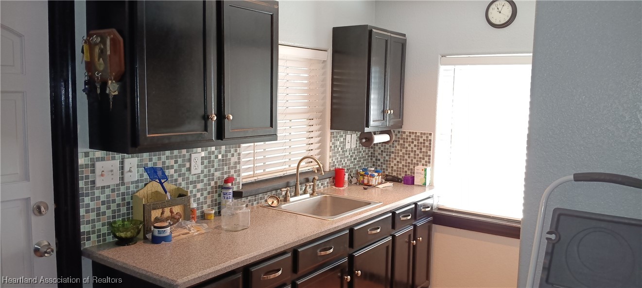 715 Stenstrom Road Wauchula, FL 33873 - Photo 10 of 11 a bathroom with a sink vanity and a mirror