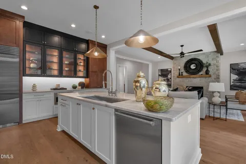 a kitchen with stainless steel appliances granite countertop a stove and a refrigerator