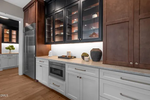 a view of a dining room with furniture and a potted plant