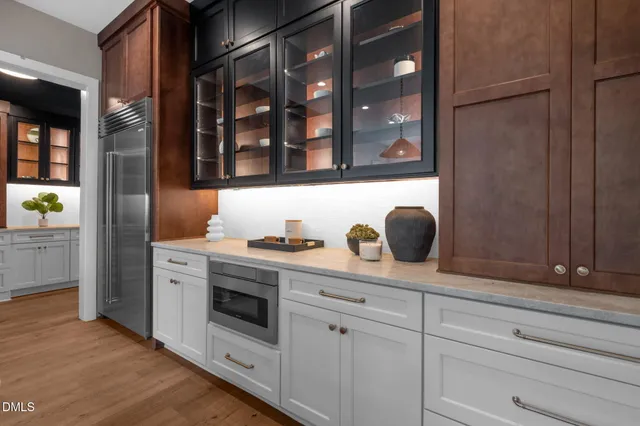 a view of a dining room with furniture and a potted plant