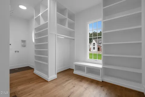 an empty room with a empty space and a window