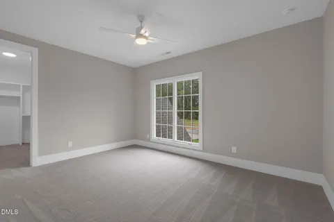 an aerial view of a house with swimming pool garden and patio