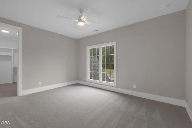 an aerial view of a house with swimming pool garden and patio