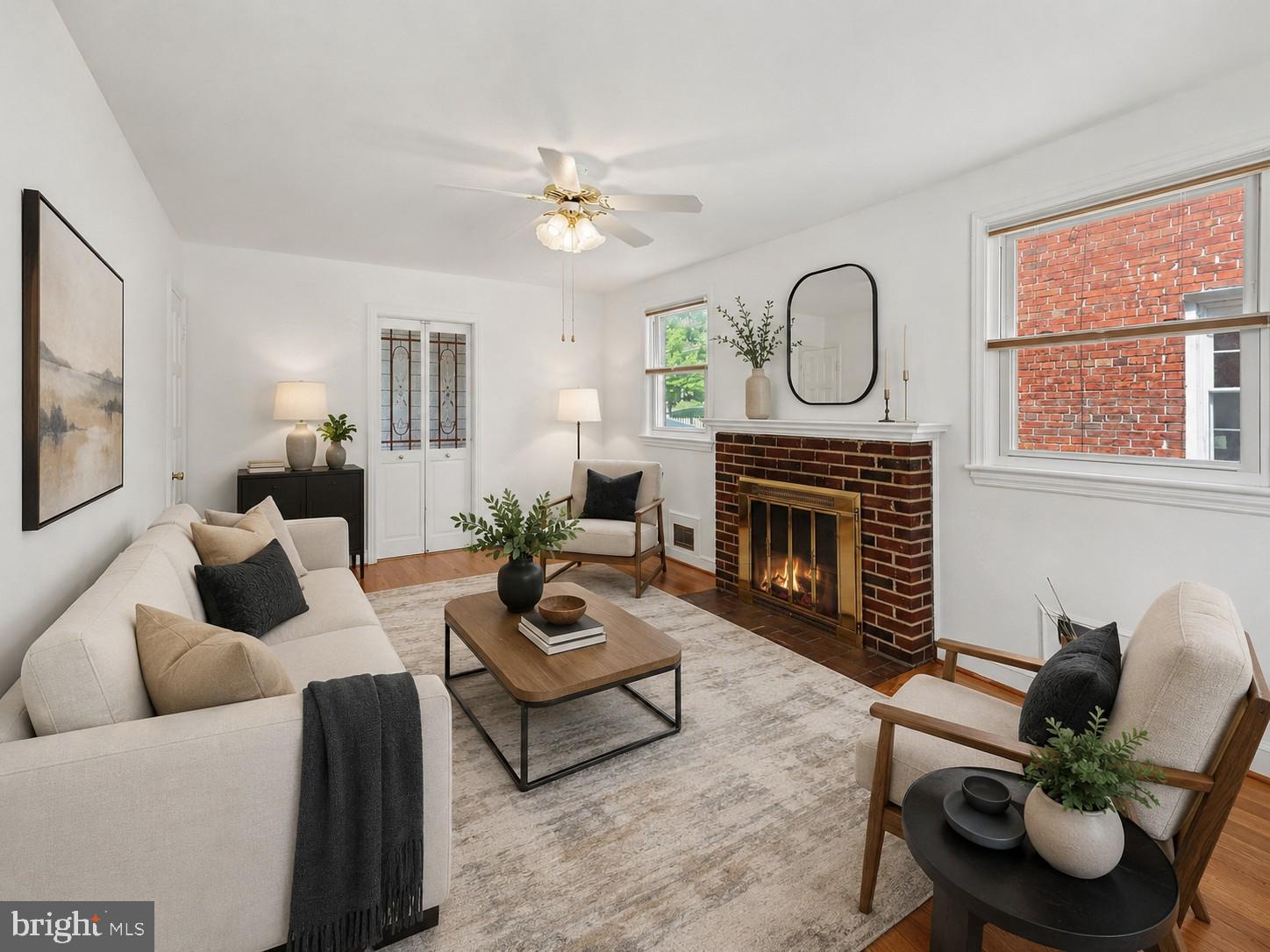 4504 20th Street Northeast Washington, DC 20018 - Photo 1 of 48 a living room with furniture a fireplace a window and a flat screen tv