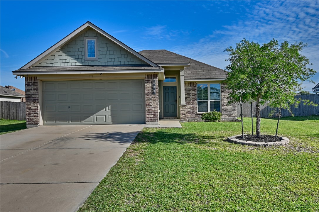 808 Mockingbird Street Navasota, TX 77868 - Photo 1 of 19 a front view of a house with a yard