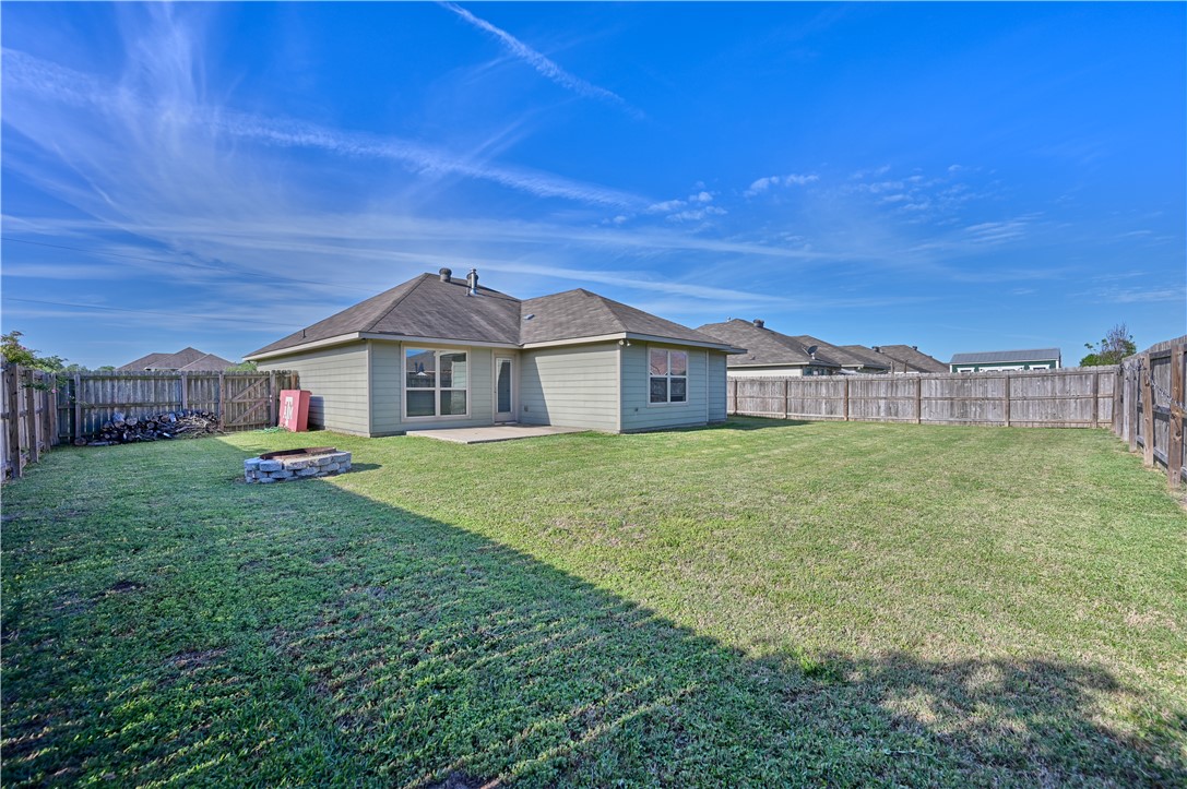 808 Mockingbird Street Navasota, TX 77868 - Photo 17 of 19 a yellow and red house with a garden