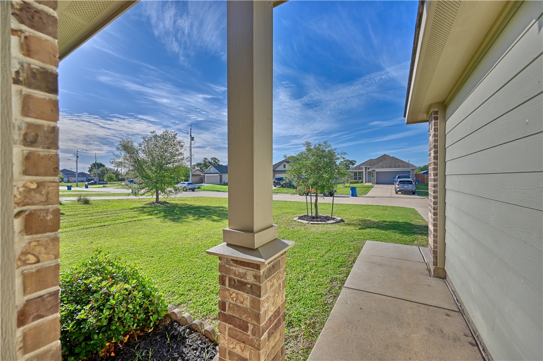 808 Mockingbird Street Navasota, TX 77868 - Photo 2 of 19 a view of a backyard with a garden and plants
